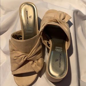 Woman’s Tan colored slip one with small chunk heel